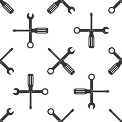 Spanner and screwdriver tools icon seamless pattern on white background. Service tool symbol. Flat design. Vector Illustration