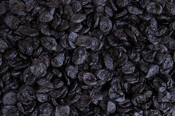 Dried black plum top view food background