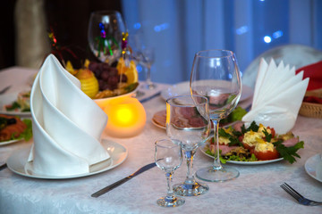 A beautiful decorated table with snacks and glasses