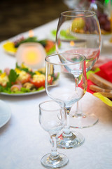 Empty glasses of wine and water on the holiday table