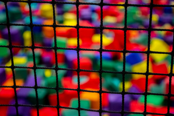 the grid on the blurred background of colored cubes