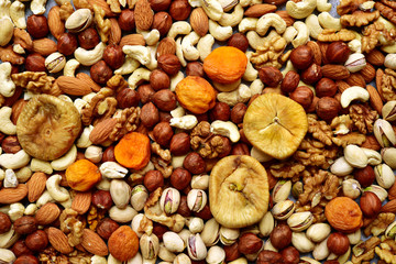 Assortment of nuts and dried fruits - healthy snack.Top view with copy space.