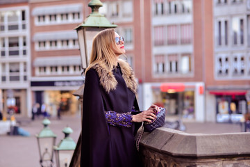 intelligent women in a black coat on the background of the castle