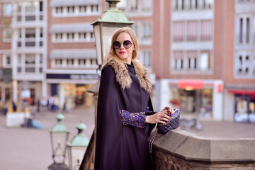 intelligent women in a black coat on the background of the castle