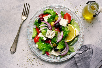 Vegetable salad with feta cheese - traditional dish of greek cuisine.Top view.
