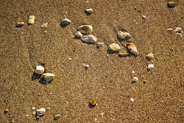 sea sand and stones background texture vacation concept with empty copy space