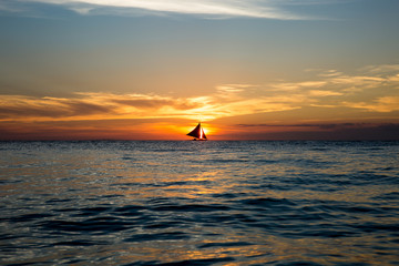  yacht on the horizon at sunset
