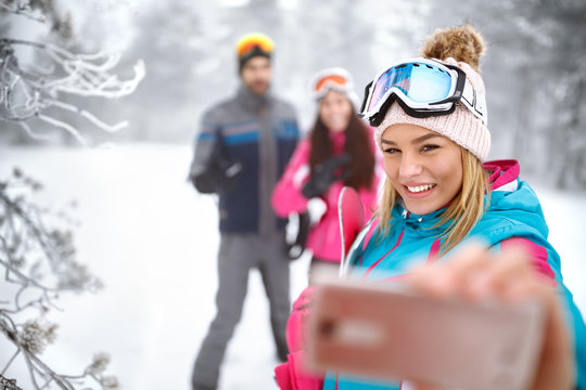 Girl making selfie on skiing