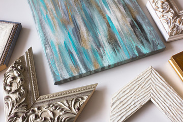 Picture framing. Artwork on canvas and samples of frames.