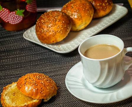 Breakfast with krachel. delicious moroccan sweet sesames rolls and cup of warm milk