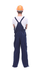 rear view. confident man wearing overalls and a crash helmet.