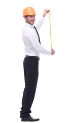 in full growth. young architect with yellow tape measure