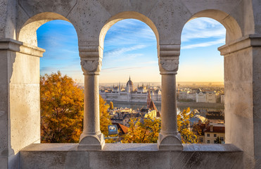 Budapest, Hungary - The beautiful Hungarian Parliament building through old windows of Buda...