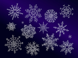 Set of hand drawn doodle style snowflakes isolated on blue background. Vector illustration.