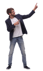 full growth.smiling business man pointing to copy space.