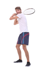 rear view. a young man with a tennis racket.