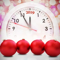 Composite image of red baubles christmas decoration