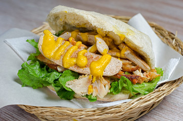  homemade sausage sandwich with mustard