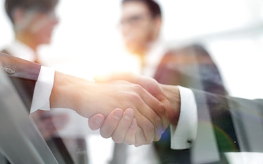Business men shaking hands. Closeup.