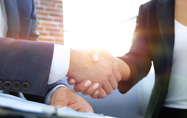 Close-up of two business people shaking hands