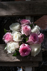 Wedding bouquet on weathered wooden ladder. Spanish country style background