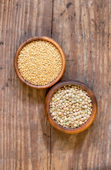 Wood bowls filled with organic lentils and couscous.