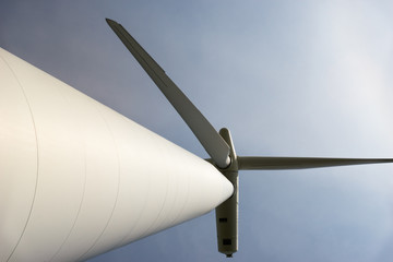 Looking up the tower of a wind turbine