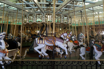 carousel at amusement park boardwalk on the beach