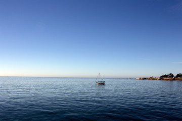 Sailboat at mooring in harbor