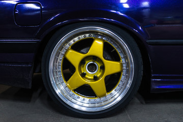 Legendary alloy two-piece sport rims on beautiful wheels in polished and gold color