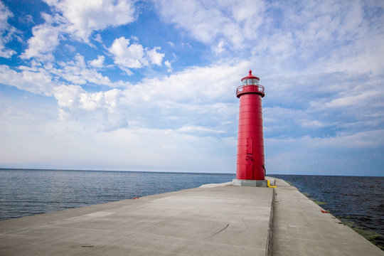 Lighthouse Background With Copy Space. Grand Haven Michigan lighthouse on a sunny day along the coast of Lake Michigan.