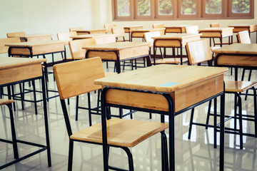 Back to school concept. School empty classroom, Lecture room with desks and chairs iron wood for studying lessons in highschool thailand without young student, interior of secondary education