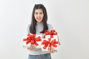 Young woman happy hold gift box in hands