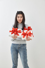 Fototapeta premium Young woman happy hold gift box in hands