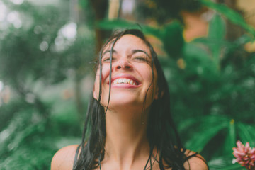 a happy woman in the rain - Powered by Adobe