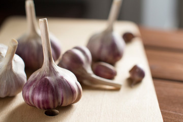 garlic on wooden cutting board