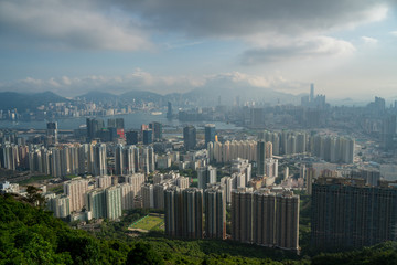 Looking down on Hong Kong from kowloon peak on a hazy afternoon. Apartment and office buildings