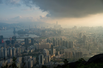 Naklejka premium Beautiful afternoon light over Hong Kong at sunset. Modern Chinese city, viewed from above