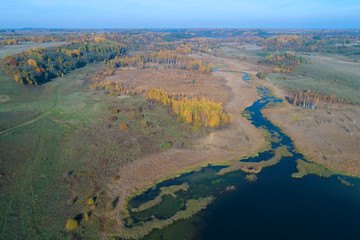 Fototapeta na wymiar View of the Izborsko-Malsky valley in the Indian summer. Pskov region, Russia