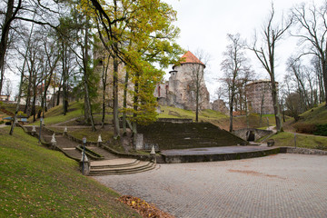 Old Casttle park at autumn. Yellow leafs, ruins and architecture. Historic buildings. Travel photo 2018.