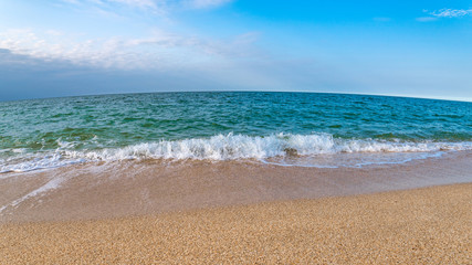 Empty beach with yellow sand and turquoise water