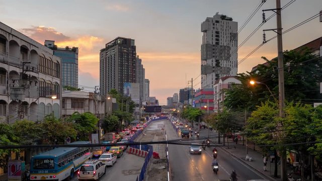 BANGKOK, THAILAND-OCTOBER 28, 2018 : Timelapse Traffic jam at Ladprao road during construction in "Monorail" yellow line. BTS Skytrain in the evening at Ladprao, Bangkok, Thailand. 4K Footage video.