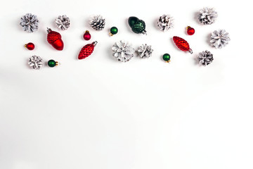 Border from Christmas holiday decorations on white background with space for text.