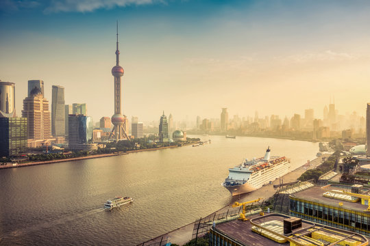 Aerial view on Shanghai, China. Beautiful daytime skyline with skyscrapers and the Hunapu river.