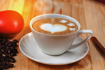 White Cup of coffee on Pine wood desktop table on top