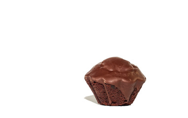Single chocolate black cupcake coated in chocolate isolated on white background
