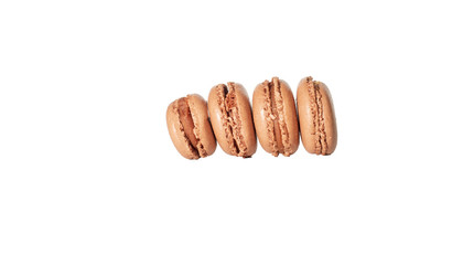 stack of freshly baked macroni cookies laying on white background