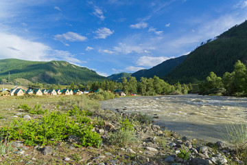 Fototapeta na wymiar Camp site on the river bank. Altai. Russia