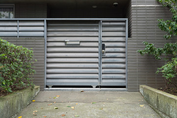 sidewalk by street wall & door