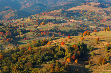 Fall in Slovakia. Meadows and fields landscape near Hrinova. Autumn colored cherry trees at sunset © matkovci
